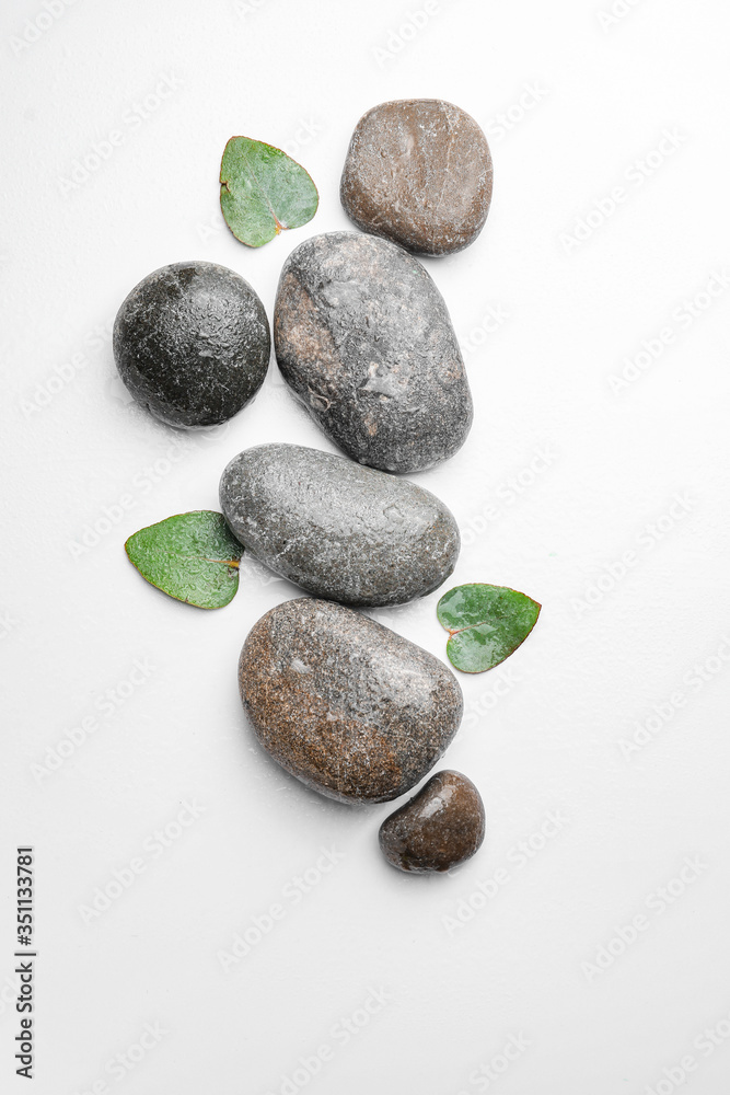 Spa stones on white background