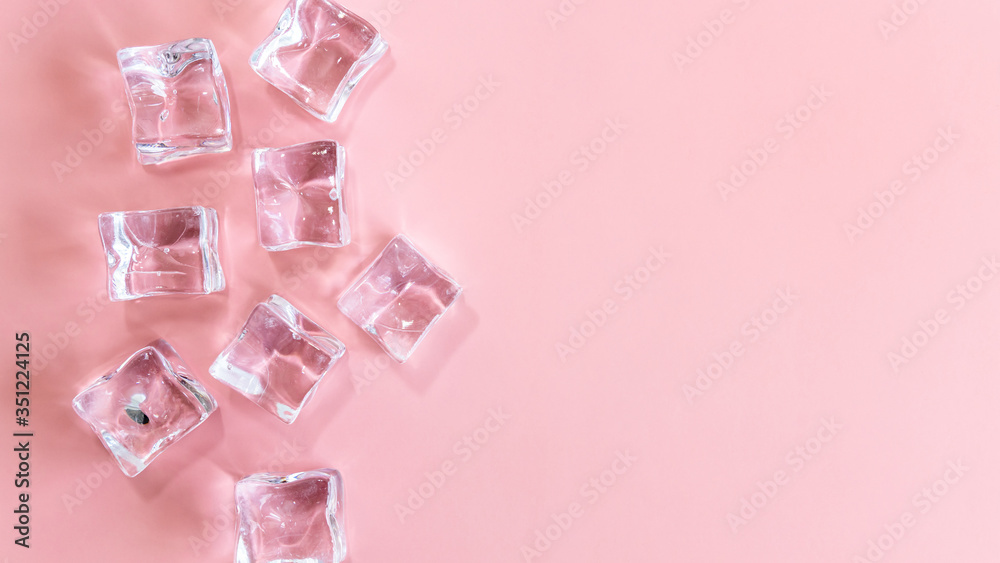 Ice cubes on pink background, Cubes of ice on a light pink background, Flat lay, top view, with copy