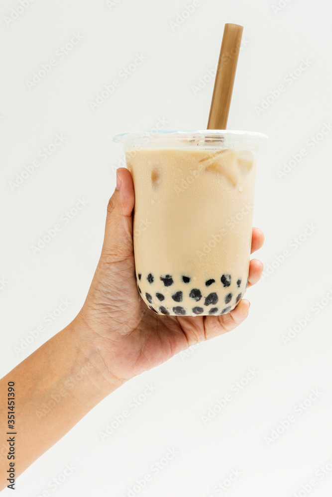 Woman holding a cup of bubble milk tea