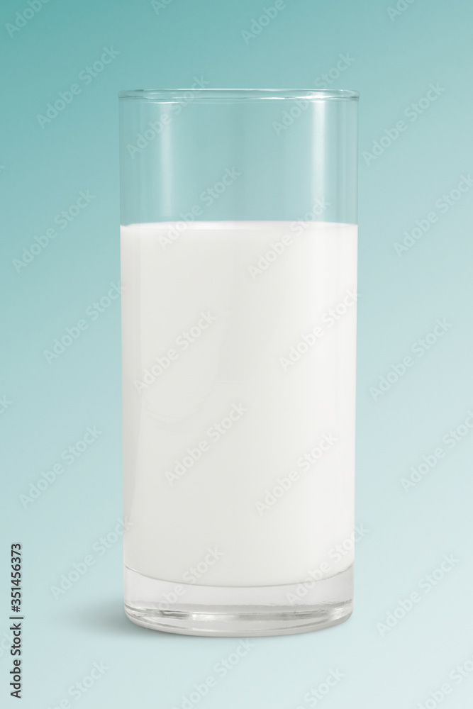 Fresh milk in a glass on blue background mockup