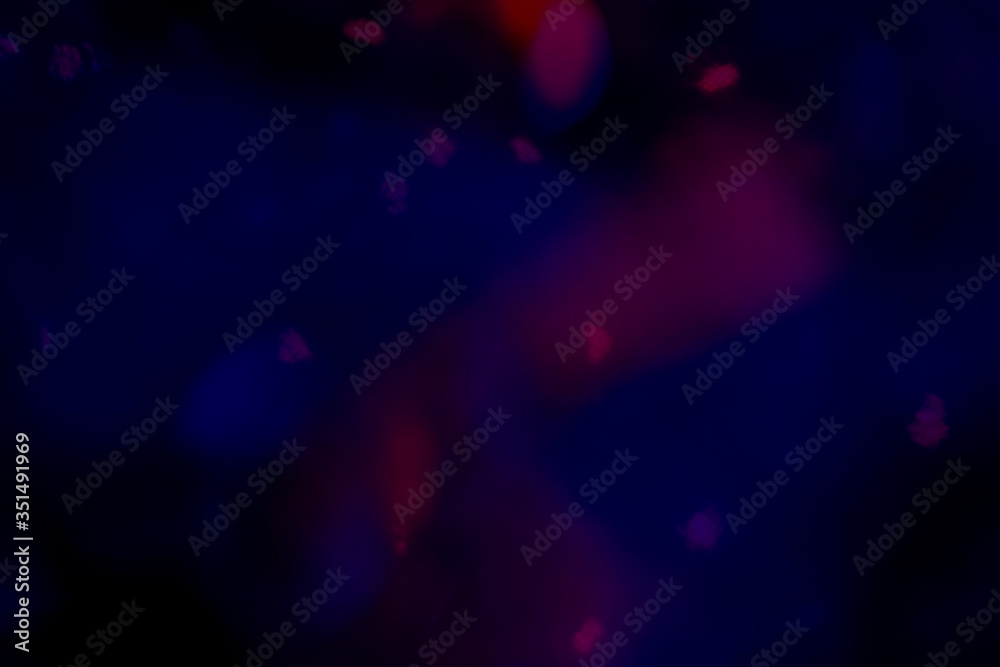 Red bokeh patterned on a dark blue background