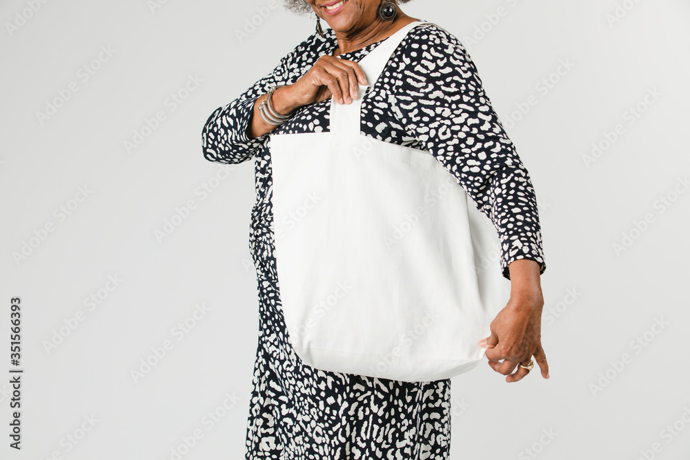 Senior woman holding a tote bag