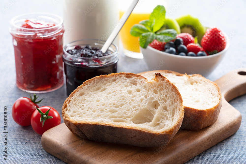 Breakfast image of bread, jam and fruit