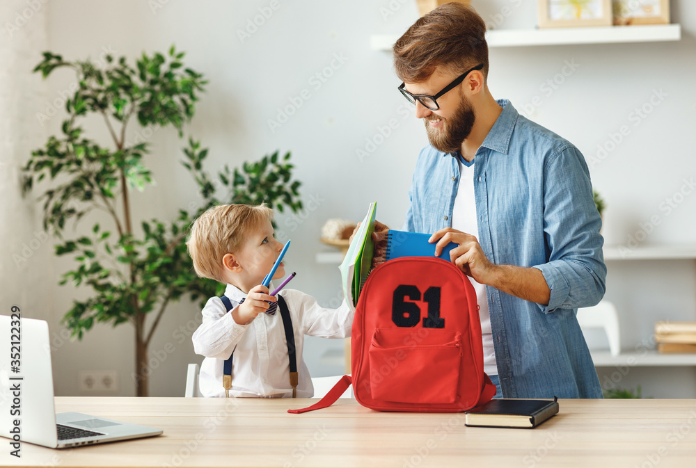 Father and kid preparing school backpack