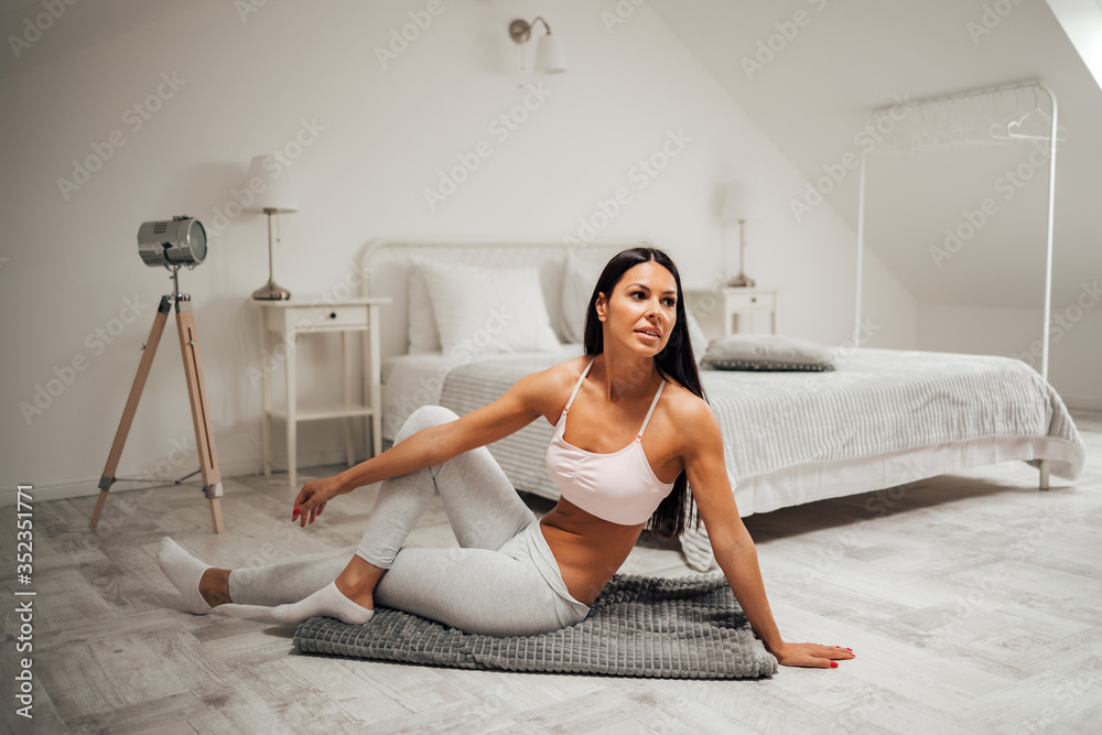 Beautiful woman exercising at modern loft, portrait.