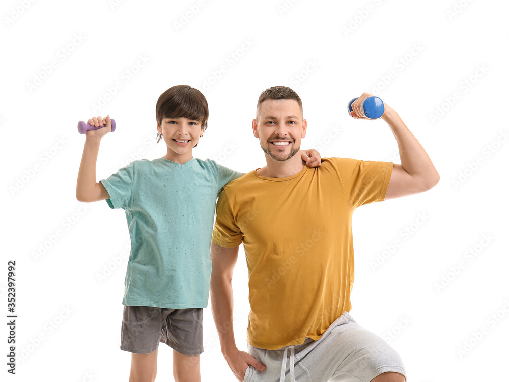 Father and little son with dumbbells on white background