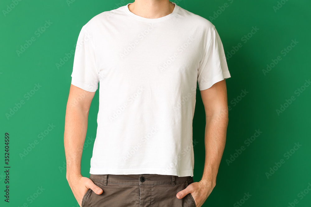 Man in stylish t-shirt on color background