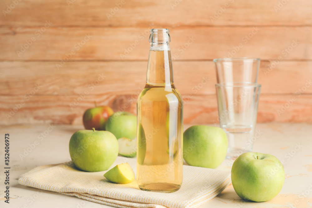 Bottle of apple cider on table