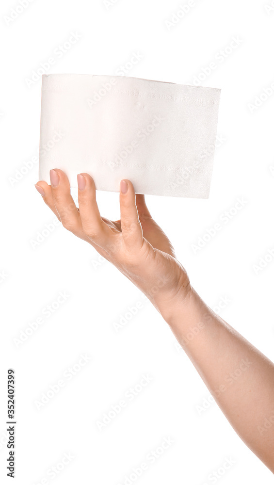 Hand with roll of toilet paper on white background