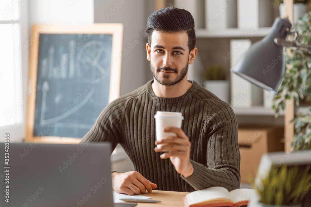 man working on a laptop at home.