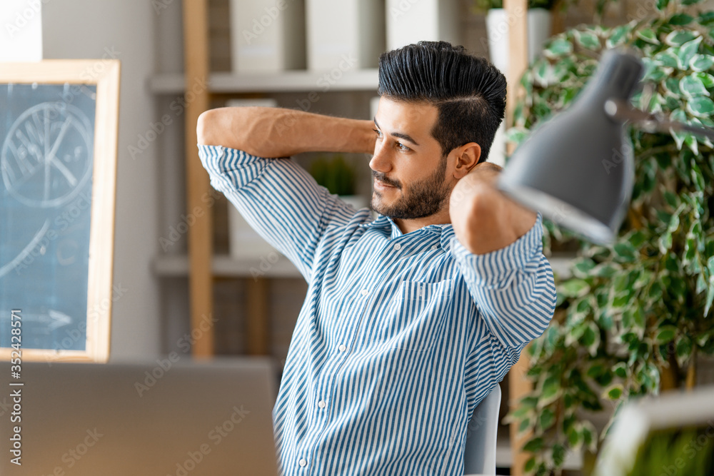 man working on a laptop at home.