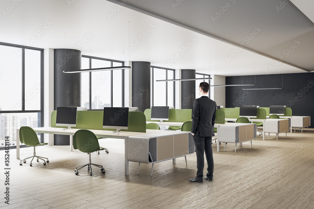 Businessman in suit standing in office interior