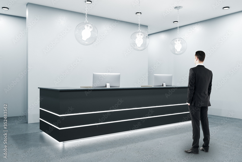 Businessman standing in modern reception room