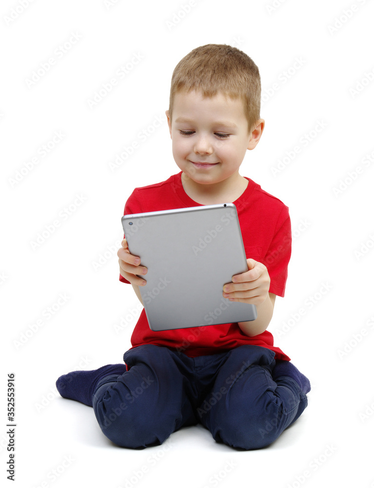 little boy looking at digital tablet computer