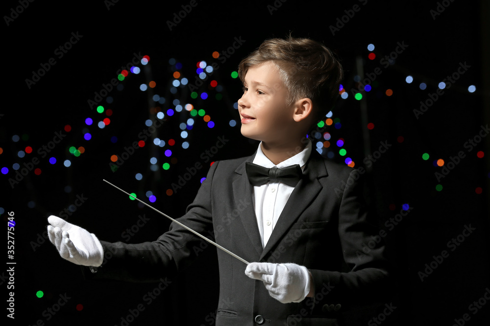 Little conductor on dark background