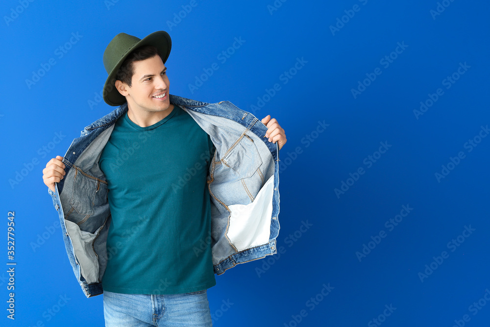 Portrait of handsome stylish man on color background