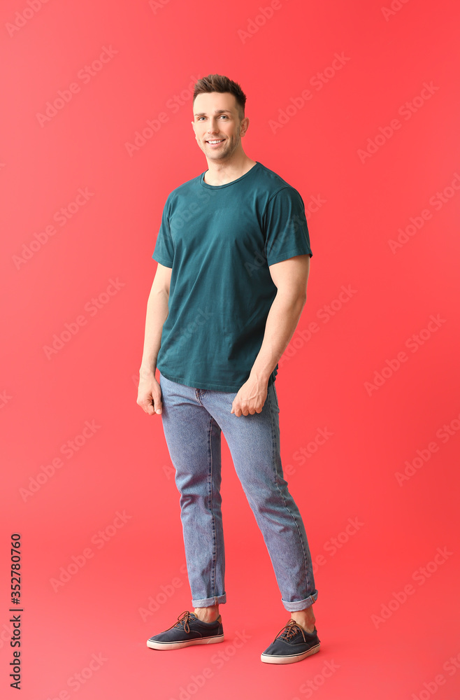 Man in stylish t-shirt on color background