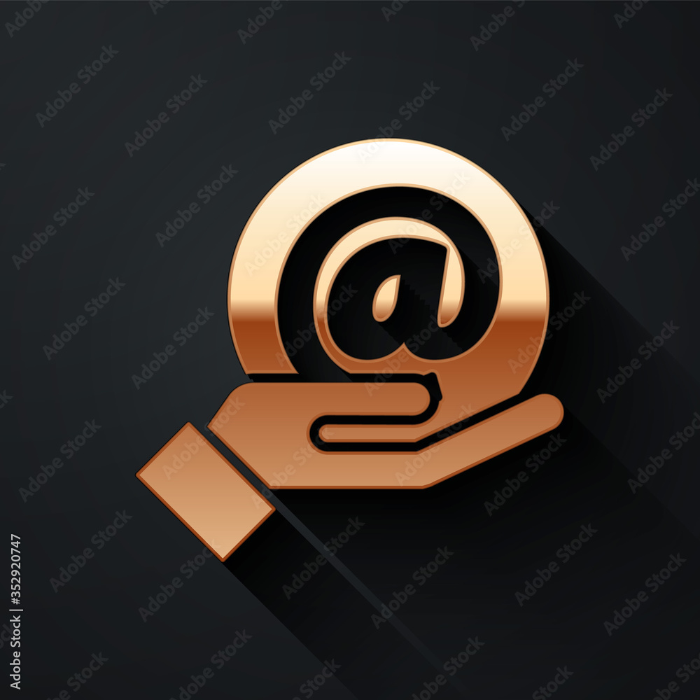 Gold Mail and e-mail in hand icon isolated on black background. Envelope symbol e-mail. Email messag