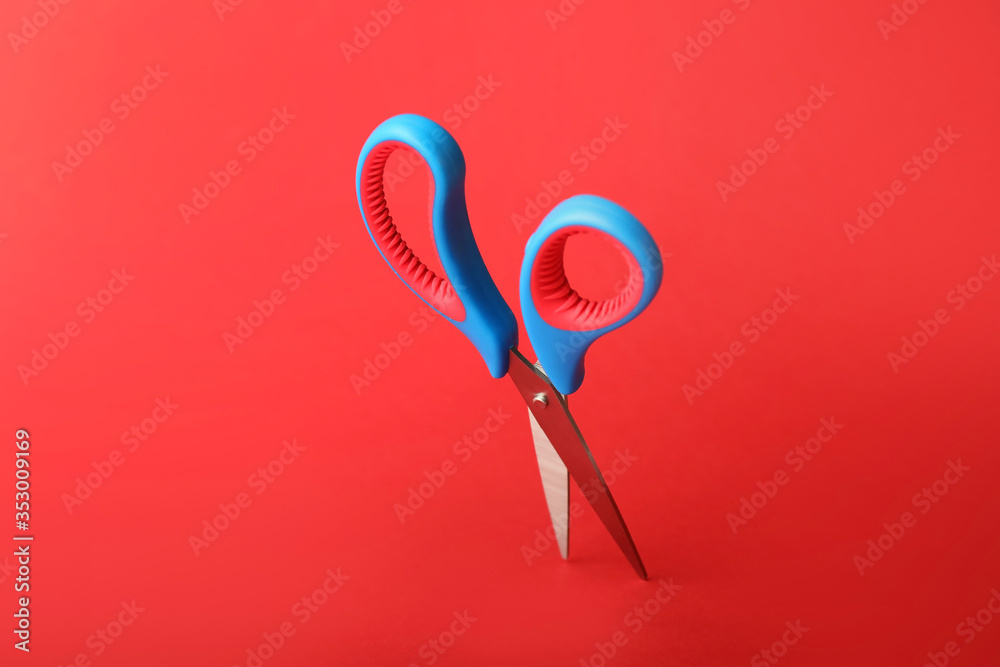 Scissors for paper on color background