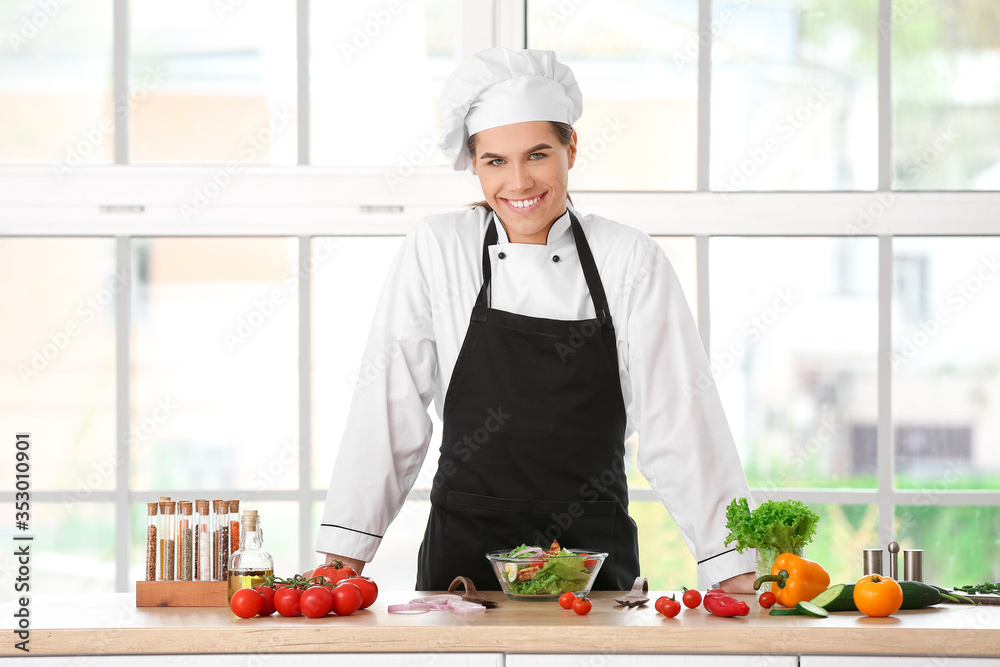 Transgender chef making salad in kitchen