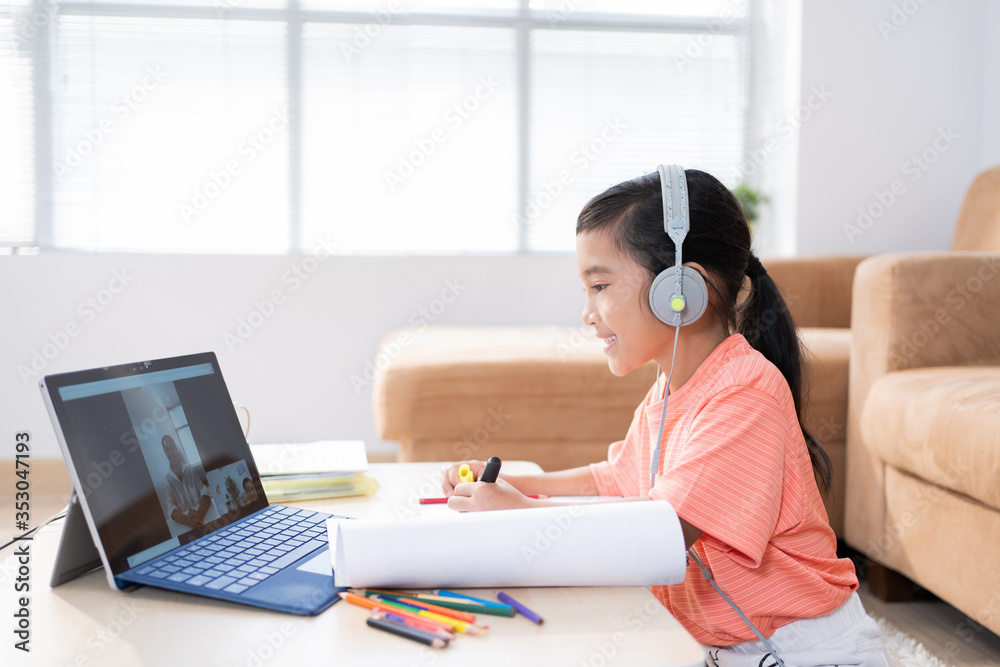 Asian girl Studying online with teacher Students are at home