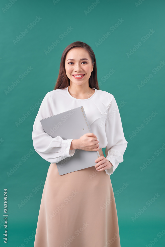 Happy successful business woman with gray folder