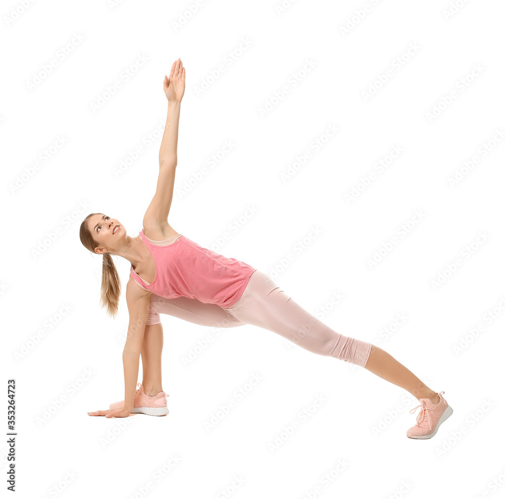 Sporty young woman practicing yoga on white background