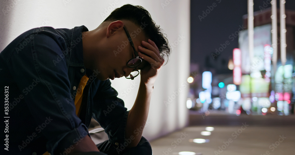 man upset and sit outdoor