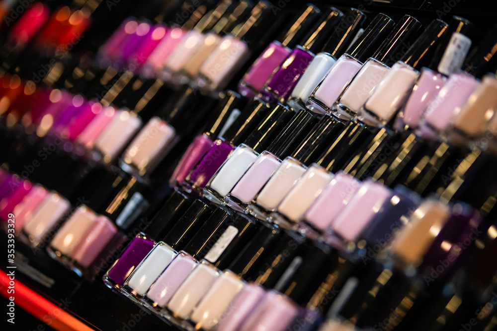 Set of nail polish on shelves in cosmetics beauty store