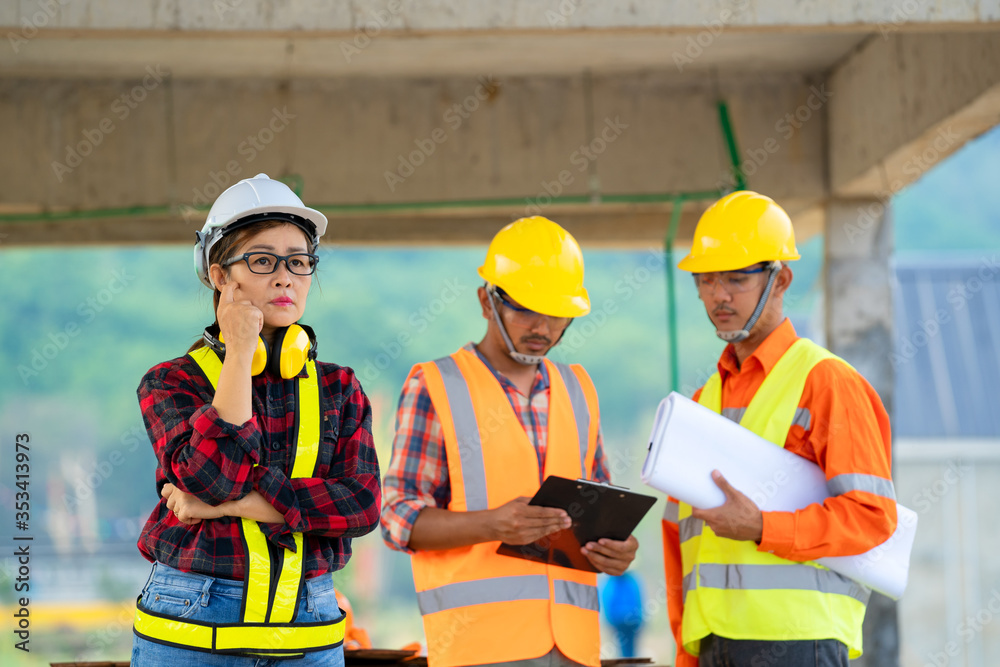 Group of Asian engineers or architect and construction worker at under construction site building.