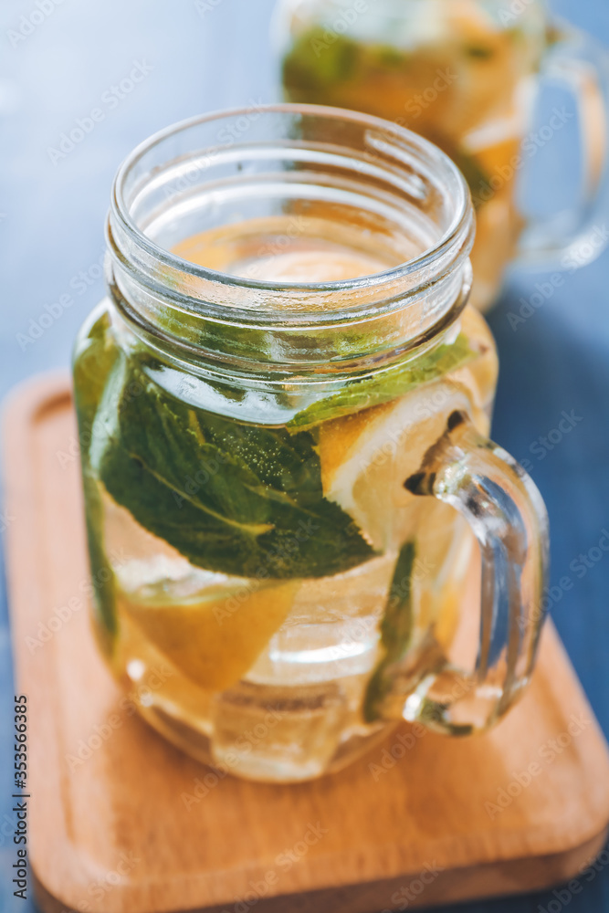 Mason jar of fresh lemonade on table