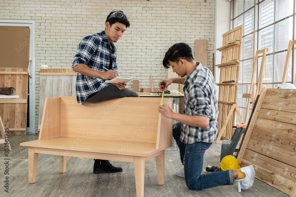 Carpenter working on wood craft at workshop to produce construction material or wooden furniture. Th