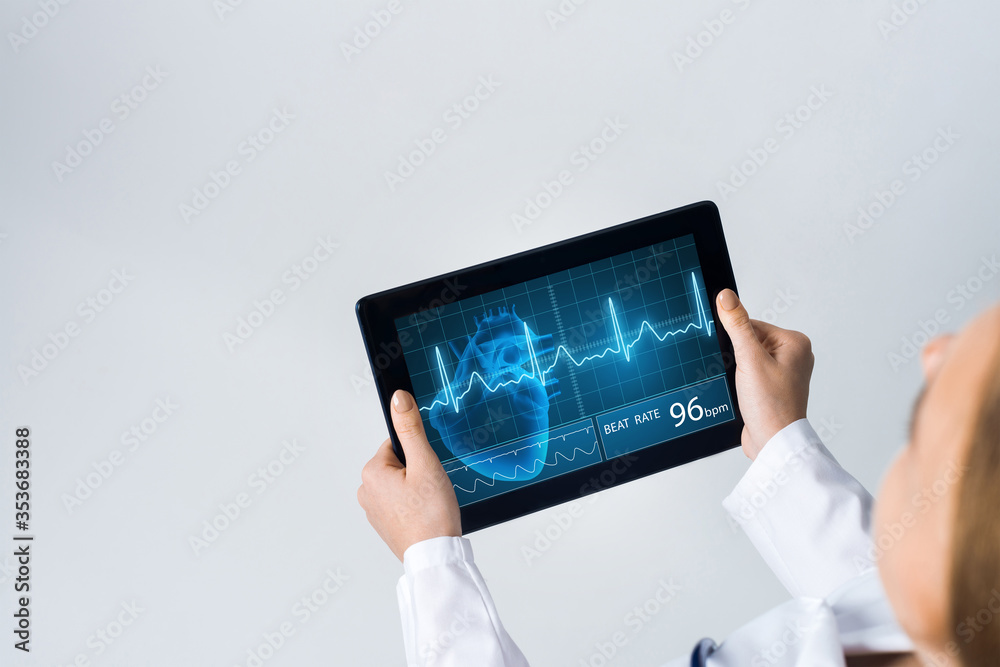 Close of female doctor hands working with tablet pc computer