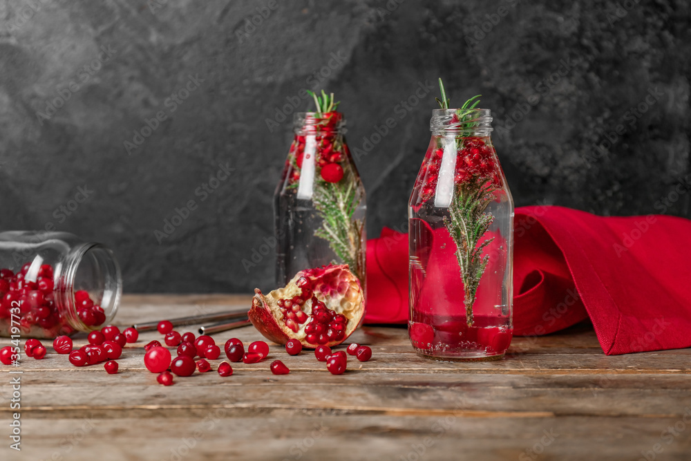 Bottles of healthy cocktail on table