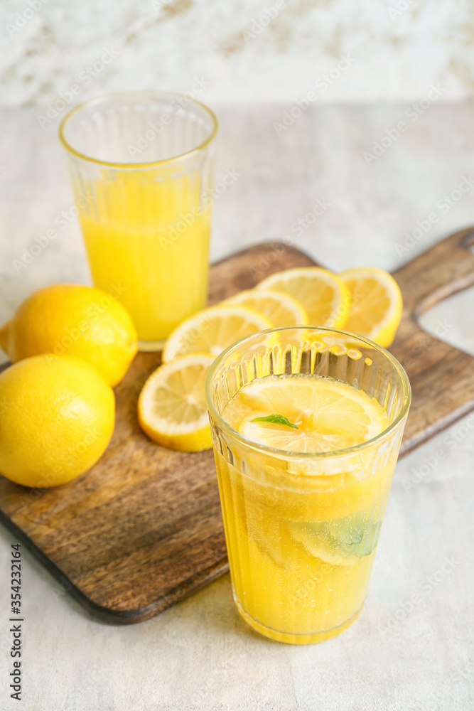 Composition with fresh lemonade on table