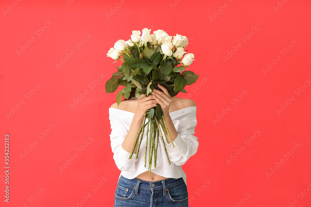 Beautiful young woman with bouquet of roses on color background