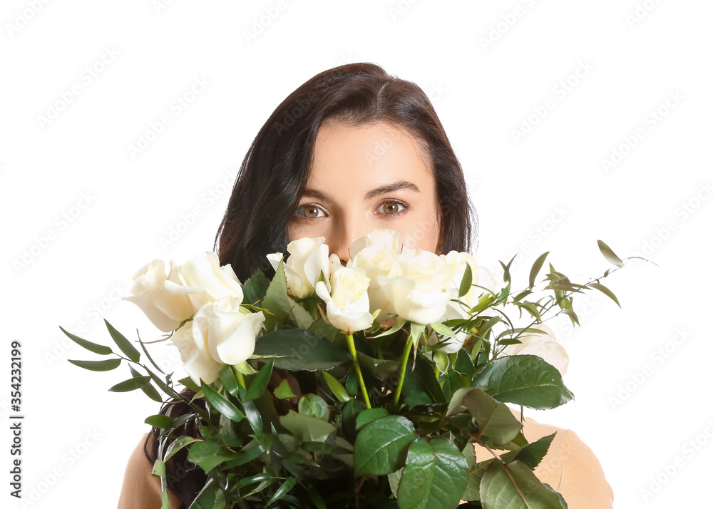 Beautiful young woman with bouquet of roses on white background