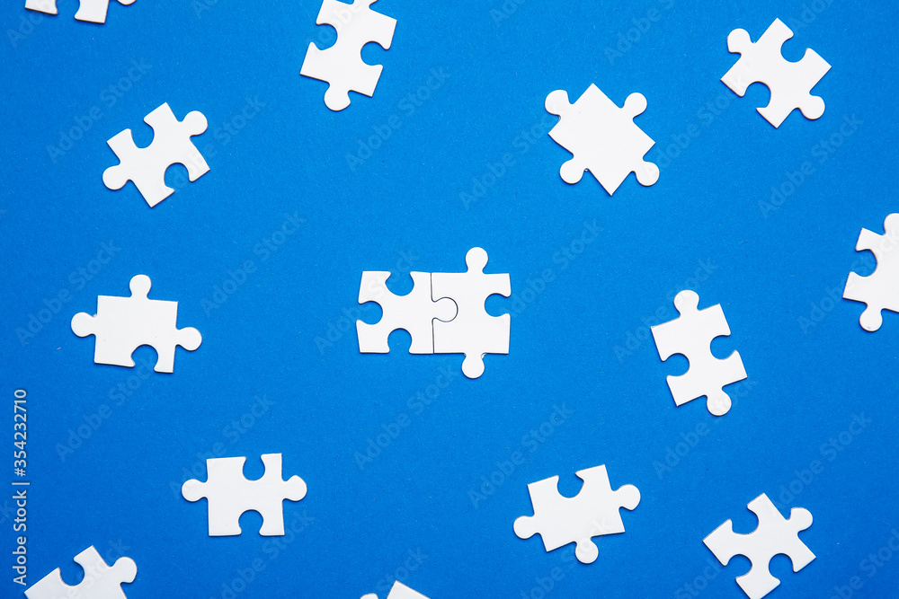 Pieces of jigsaw puzzle on color background. Unity concept