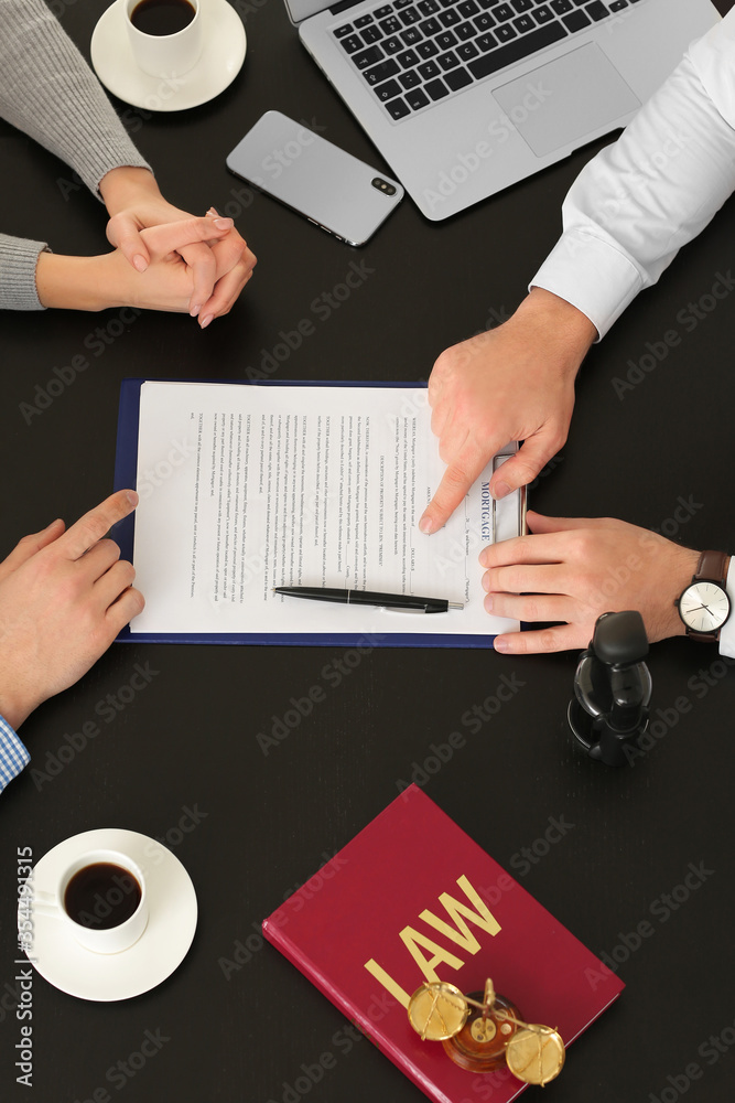 Couple visiting lawyer in office