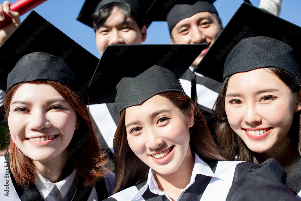 group happy graduates students