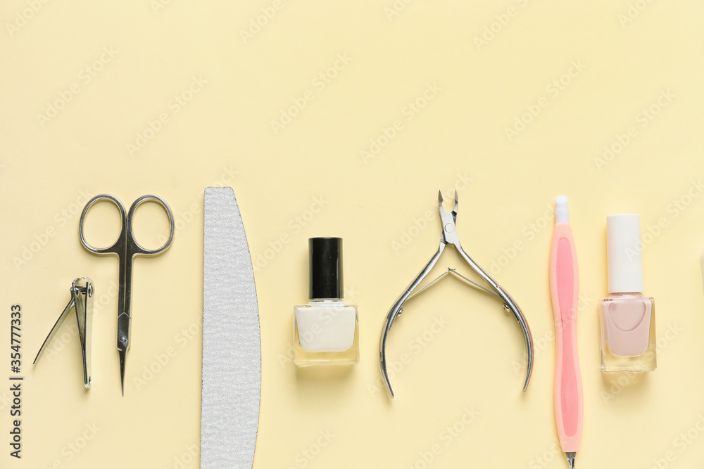 Supplies for manicure on color background