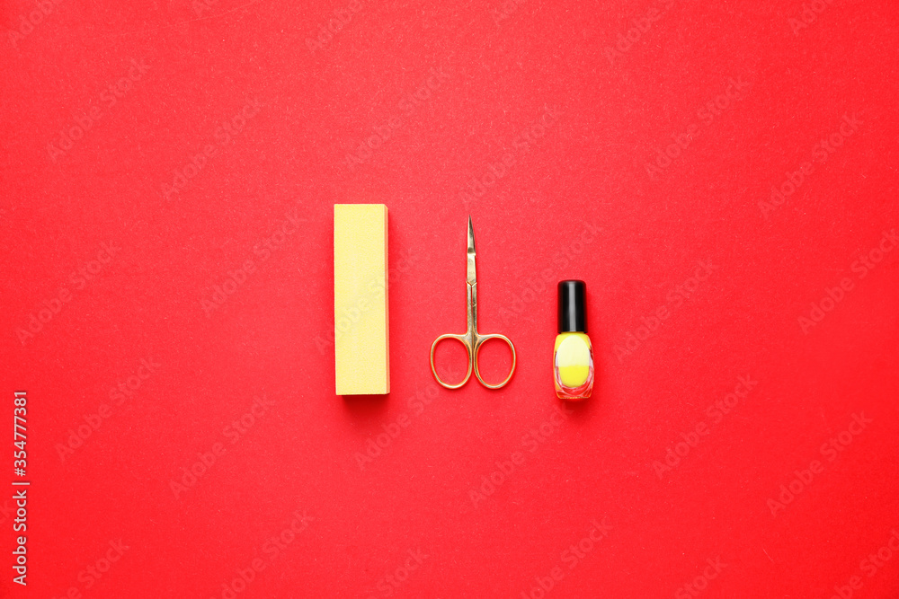 Supplies for manicure on color background