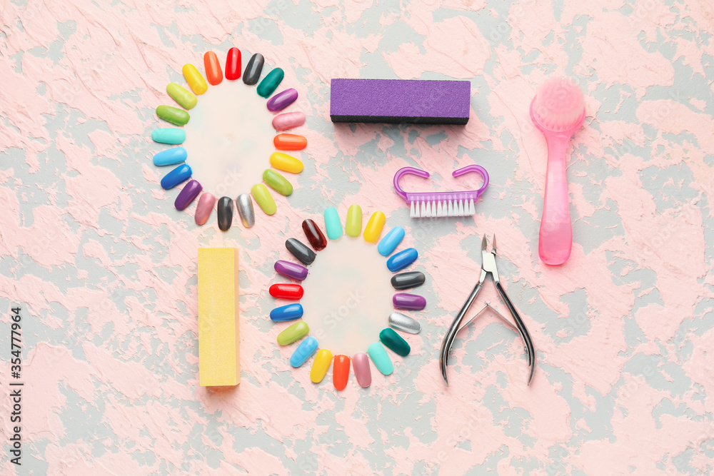 Supplies for manicure on color background