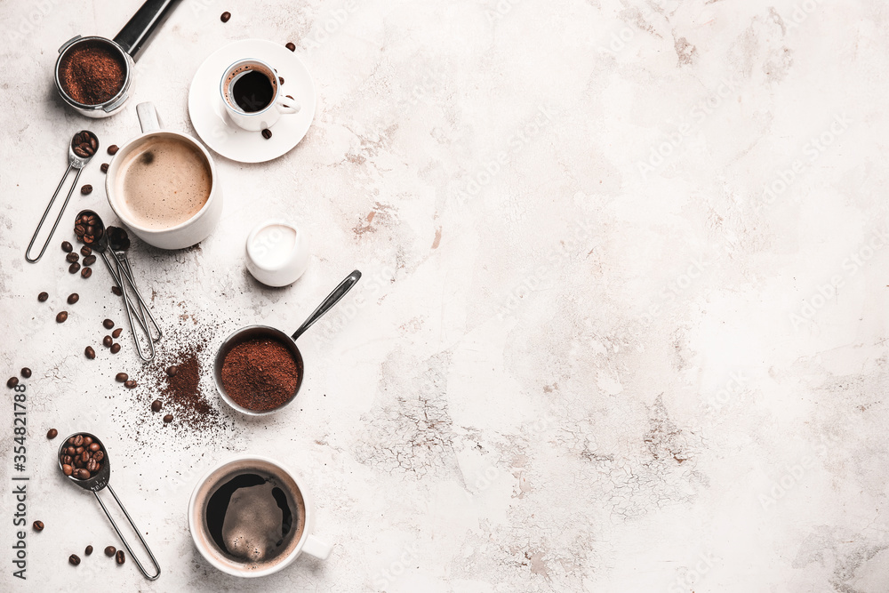 Composition with coffee beans and powder on light background