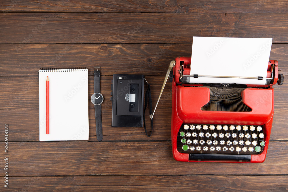 Journalism or blogging concept vintage typewriter on the wooden desk, top view