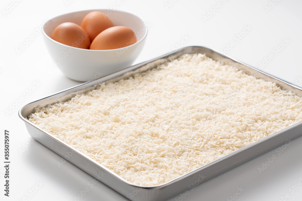 Crumbs and eggs on a white background