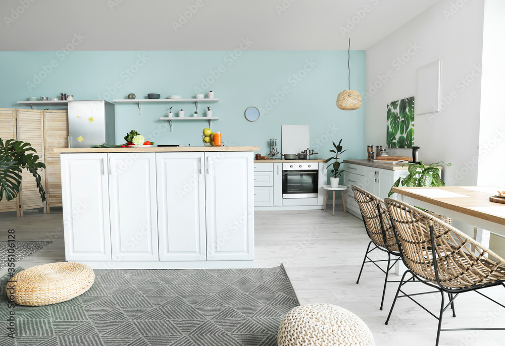 Interior of modern kitchen with stylish table