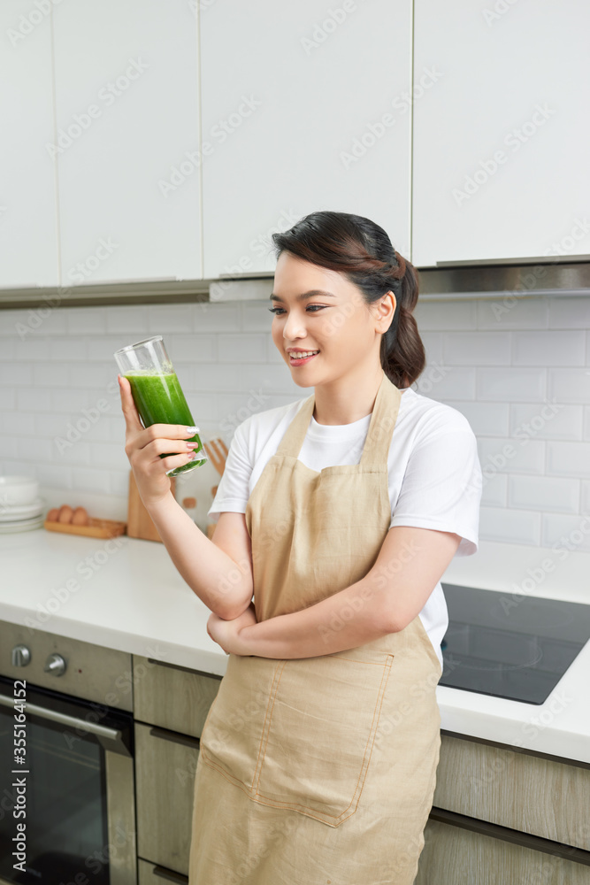 Healthy Lifestyle Concept. Close up portrait of smiling girl drinking morning smoothie made of super