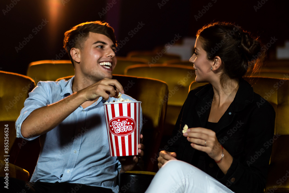 People audience watching movie in the movie theater cinema. Group recreation activity and entertainm