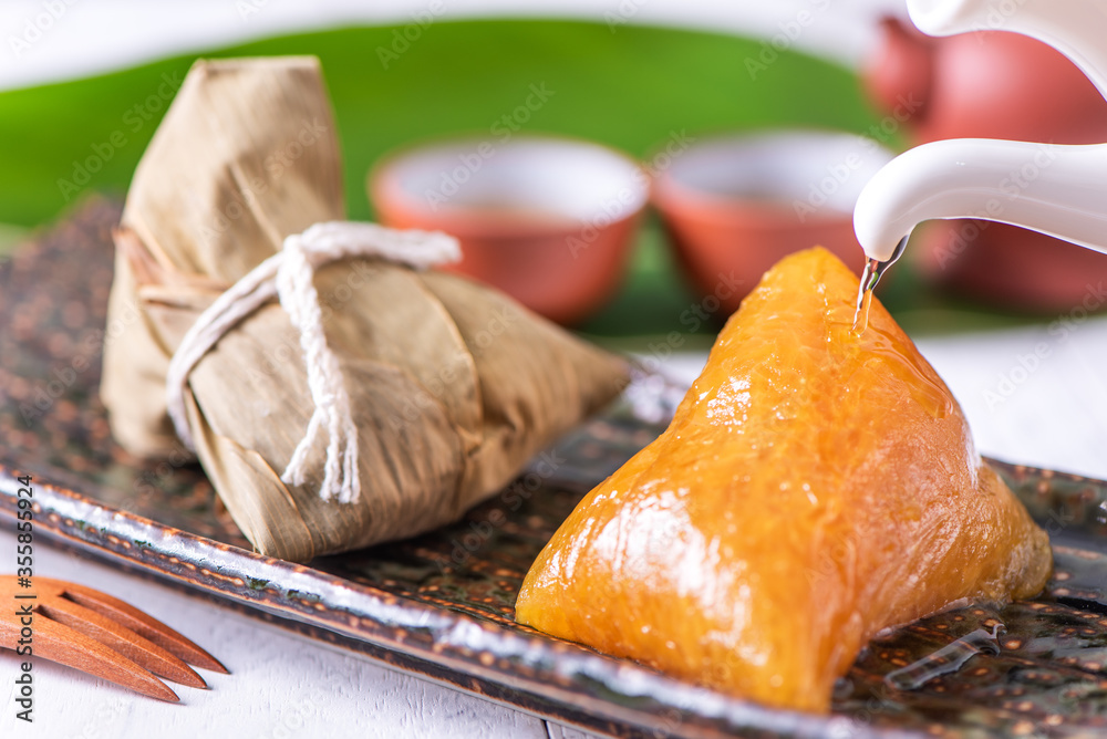 Zongzi - Alkaline rice dumpling - Traditional sweet Chinese crystal food on a plate to eat for Drago